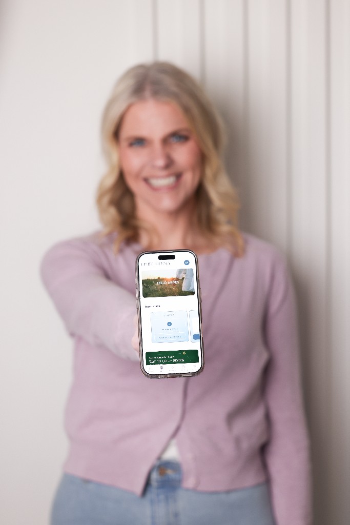 Lauren showing the Uplift Journey app